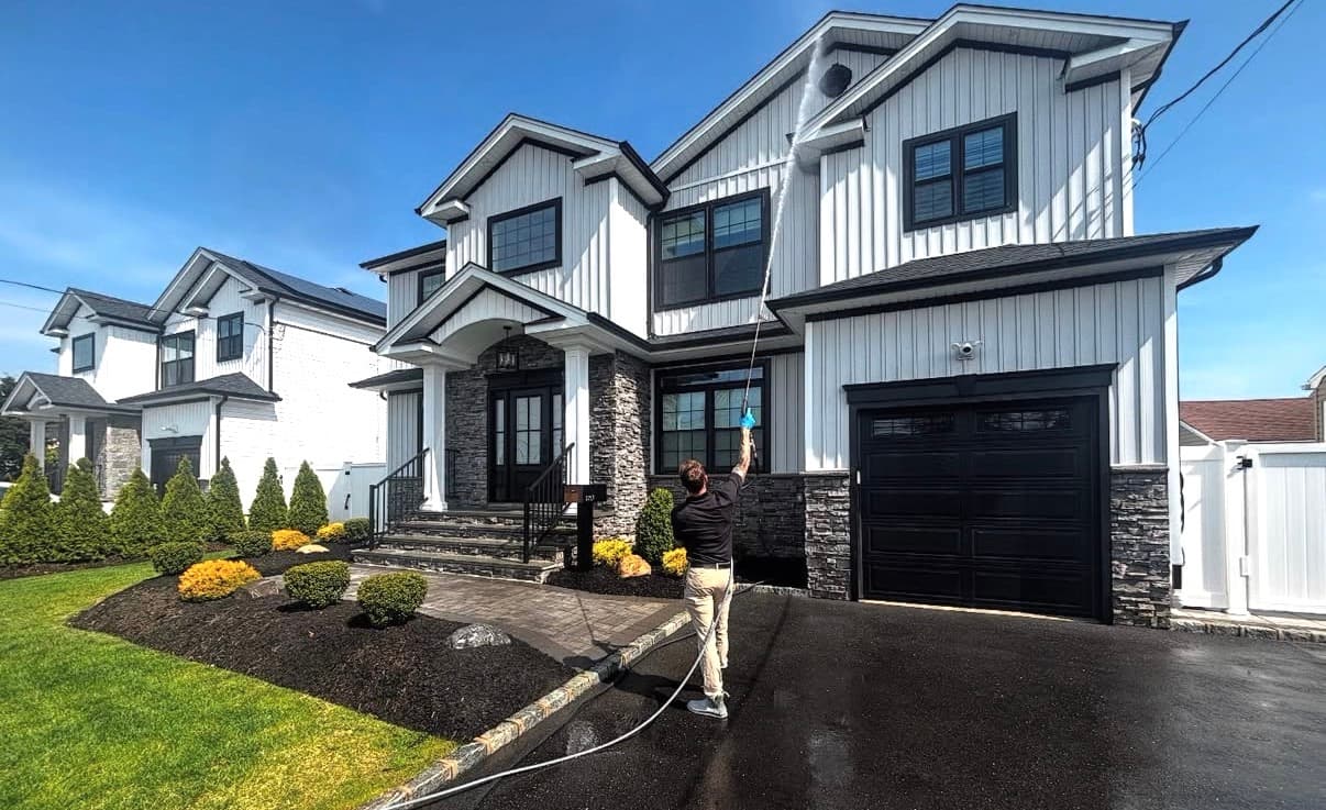 Window cleaning on modern Long Island home